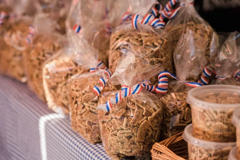 Bags of stroopwafel crumbs with red-white-and-blue ribbon and tubs at the stall